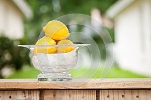 Lemons in a glass bowl at a lemonade stand