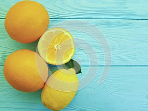 Lemons and oranges ingredient juicy citric pattern on blue wooden freshness