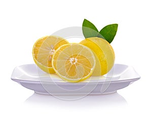 Lemons  on plate isolated on white background