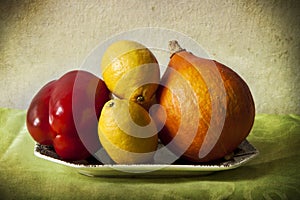 Lemons and vegetables in chiaroscuro photo
