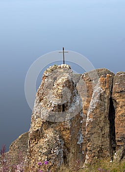 Lena Pillars, Sakha Yakutia, Russia - August 1, 2021: wooden cross on the top of the hill