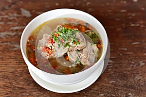 Leng boiled chilli bone food Delious. Thai food call â€œLengâ€ is boiled pork bones with spicy chili. In a white bowl, place it