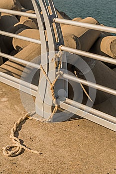 Length of rope tied around guardrail