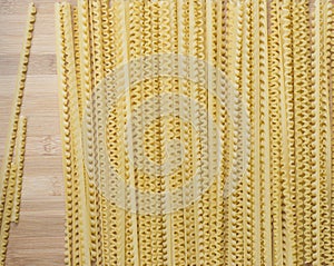 Lengths Pasta on Wooden Board