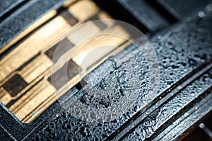 Lens barrel close-up, macro photography. Shatter-resistant coating against scratches on the lens, texture