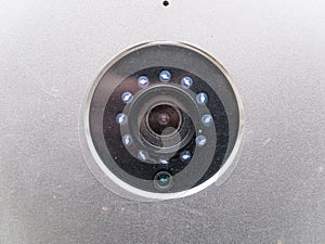 The lens of the surveillance camera in a metal case