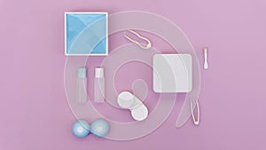 lenses, a container for lenses, tweezers and a small mirror lie on a pink background. contact lens tools