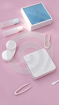 lenses, a container for lenses, tweezers and a small mirror lie on a pink background. contact lens tools