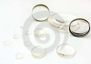 Lenses. Magnifying optical lenses close- up on a white background. Glass magnifiers isolated on a white background. photo