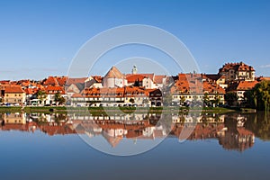 Lent district in Maribor, Slovenia. Popular waterfront promenade with historical buildings and the oldest grape vine in