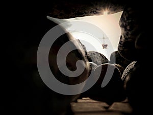 Lent, Holy Week, Easter Sunday, Good Friday Concept - view from inside grave of resurrection with blurry cross shape background