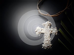 Lent Season, Holy Week, Ash Wednesday concepts.Ash cross symbol in dark background.