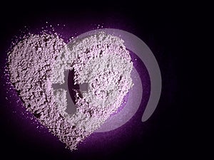 Lent Season, Holy Week, Ash Wednesday concepts.Ash heart with cross symbol in purple and black background.