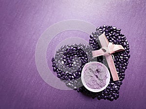 Lent Season,Holy Week and Good Friday Concepts - bowl of ash with cross made of palm leave background. Stock photo.