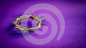 Lent Season, Holy Week and Good Friday concepts - image of crown of thorns in purple background photo