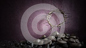 Lent Season,Holy Week and Good Friday concepts - image of crown of thorns with stones in purple vintage background