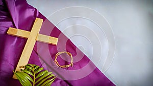 Lent Season,Holy Week and Good Friday concepts - image of wooden cross,crown of thorns and palm leave in vintage background photo