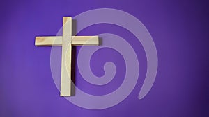 Lent Season,Holy Week and Good Friday concepts - image of wooden religious cross in purple vintage background