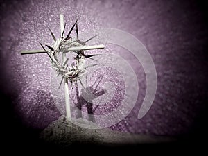Lent Season,Holy Week and Good Friday concepts - image of a woven crown of thorns on wooden cross with ash in vintage background