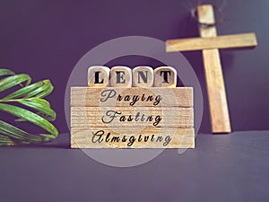 Lent Season,Holy Week and Good Friday concepts - 'lent praying fasting almsgiving' text background. Stock photo.
