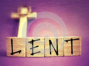 Lent Season,Holy Week and Good Friday concepts - LENT text on wooden blocks in purple vintage background. Stock photo.