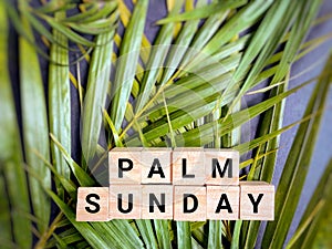 Lent Season,Holy Week and Good Friday concepts - Palm Sunday text on wooden blocks in vintage background. Stock photo.