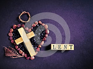 Lent Season,Holy Week and Good Friday concepts - word LENT with cross, crown of thorns and palm leave in purple vintage.