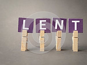 Lent Season,Holy Week and Good Friday concepts - word lent on purple wooden blocks in vintage background. Stock photo.