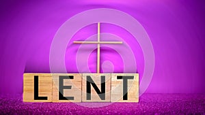 Lent Season,Holy Week and Good Friday concepts - word lent on wooden blocks with cross shape in purple background