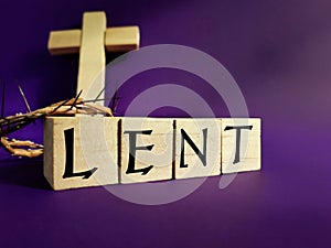Lent Season,Holy Week and Good Friday concepts - word LENT on wooden blocks in purple color background. Stock photo.