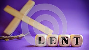 Lent Season,Holy Week and Good Friday concepts - word lent on wooden blocks in purple vintage background