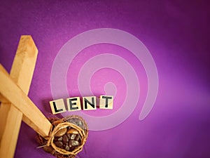 Lent Season,Holy Week and Good Friday concepts - word LENT on wooden blocks in purple vintage background. Stock photo.