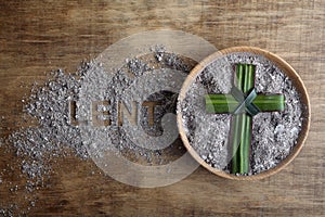 Lent word written in ash, dust as fast and abstinence period concept. Top view