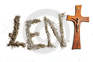 Lent word written iwith ash and christian cross as a T letter a religion concept Ash wednesday photo