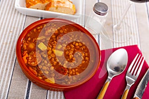 Lentejas con chorizo, beans stewed with chorizo photo