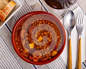 Lentejas con chorizo, beans stewed with chorizo photo