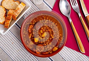 Lentejas con chorizo, beans stewed with chorizo photo