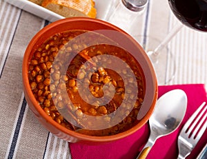 Lentejas con chorizo, beans stewed with chorizo photo