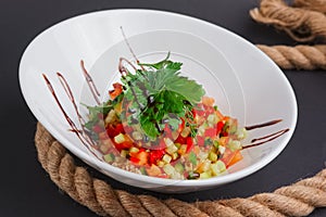 Lenten salad with tomato, marrow squash, cuscus, zucchini and paprika