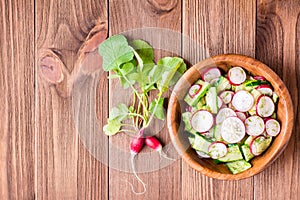 Lenten spring vegetable salad from cucumber, radish, greens