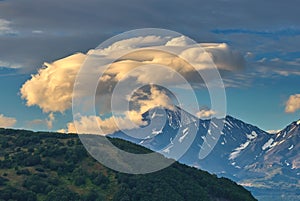 Lenticular cloud formation over volcano