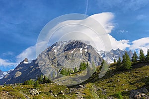 Lenticular cloud over a mountain in Val VÃ©ny, Aosta Valley, Italy