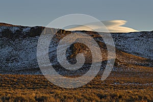 Lenticular clouds form over the Sierra Nevada photo