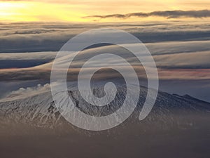 Lenticular clouds over mountain