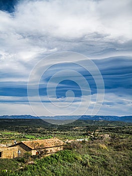 Lenticular clouds over rural landscape, MatarraÃ±a, teruel