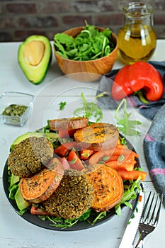 Lentil Burgers with Baked Sweet Potato and Avocado Salad with Arugula, Peppers and Tomatoes