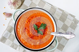 Lentil cream soup in a rustic bowl on a linen napkin