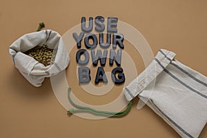 lentil in textile bag flat lay on a beige background, zero waste and no plastic bags concept