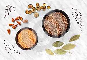Lentils and cooking ingredients on marble background