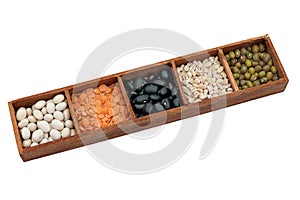 Lentils and pulses in box, isolated over white